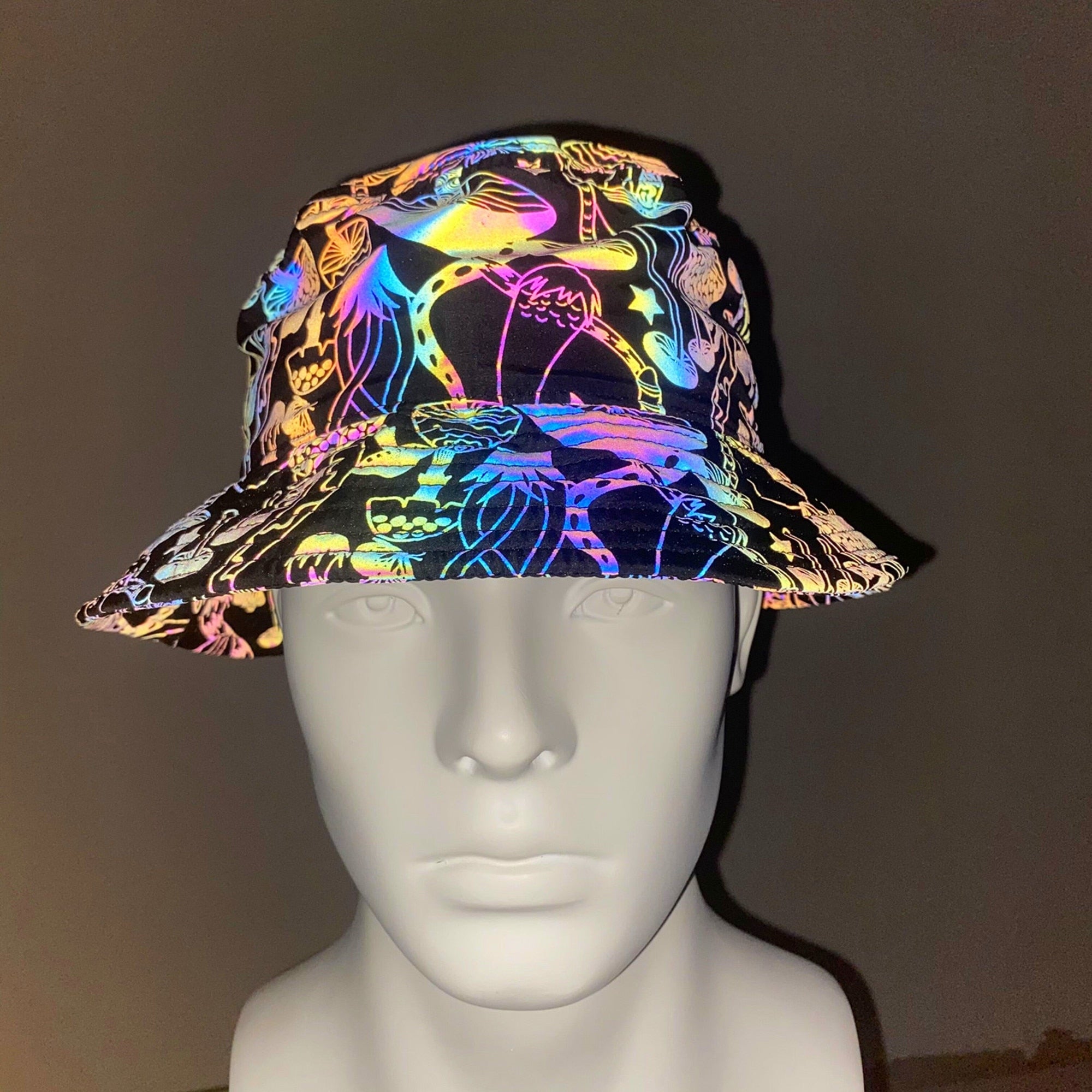 Discover a new and exciting way to express your style with hip HOLOGRAPHIC RAVE BUCKET HATS. Featuring a bold holographic design, these bucket hats are perfect for any Music Festival or Rave. Show off your unique fashion sense while staying safe, comfortable, and protected from the sun with these Trippy Rave Inspired Designs! 